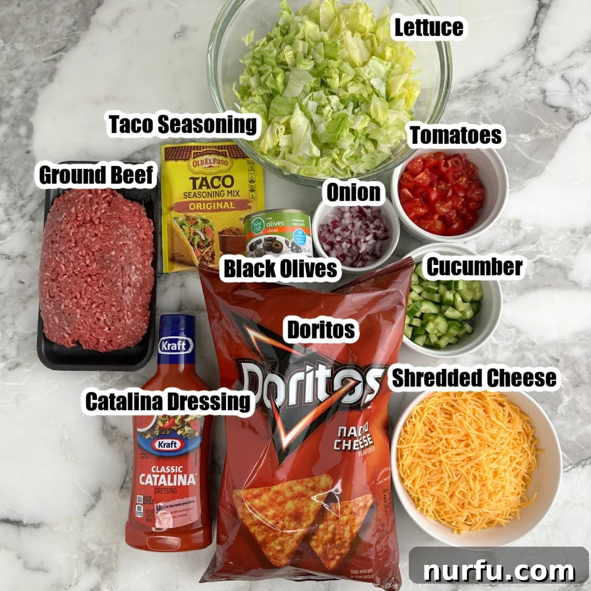 Catalina Kicked Taco Salad 3 Selection of ingredients: ground beef, lettuce, cheese, Doritos, Catalina dressing, taco seasoning, diced tomatoes.