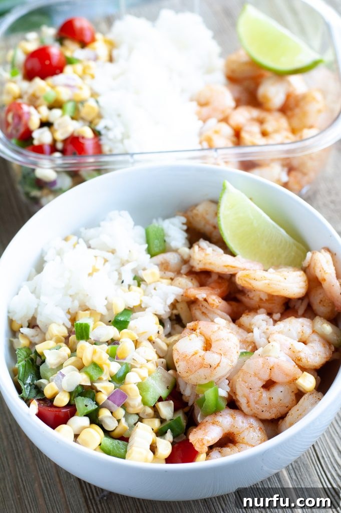 Individual Cajun shrimp meal prep bowl with perfectly portioned shrimp, rice, and corn salad