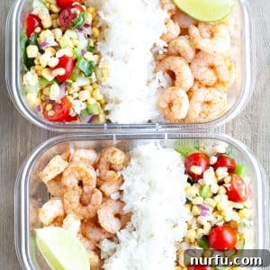 Container with shrimp, rice and corn salsa.