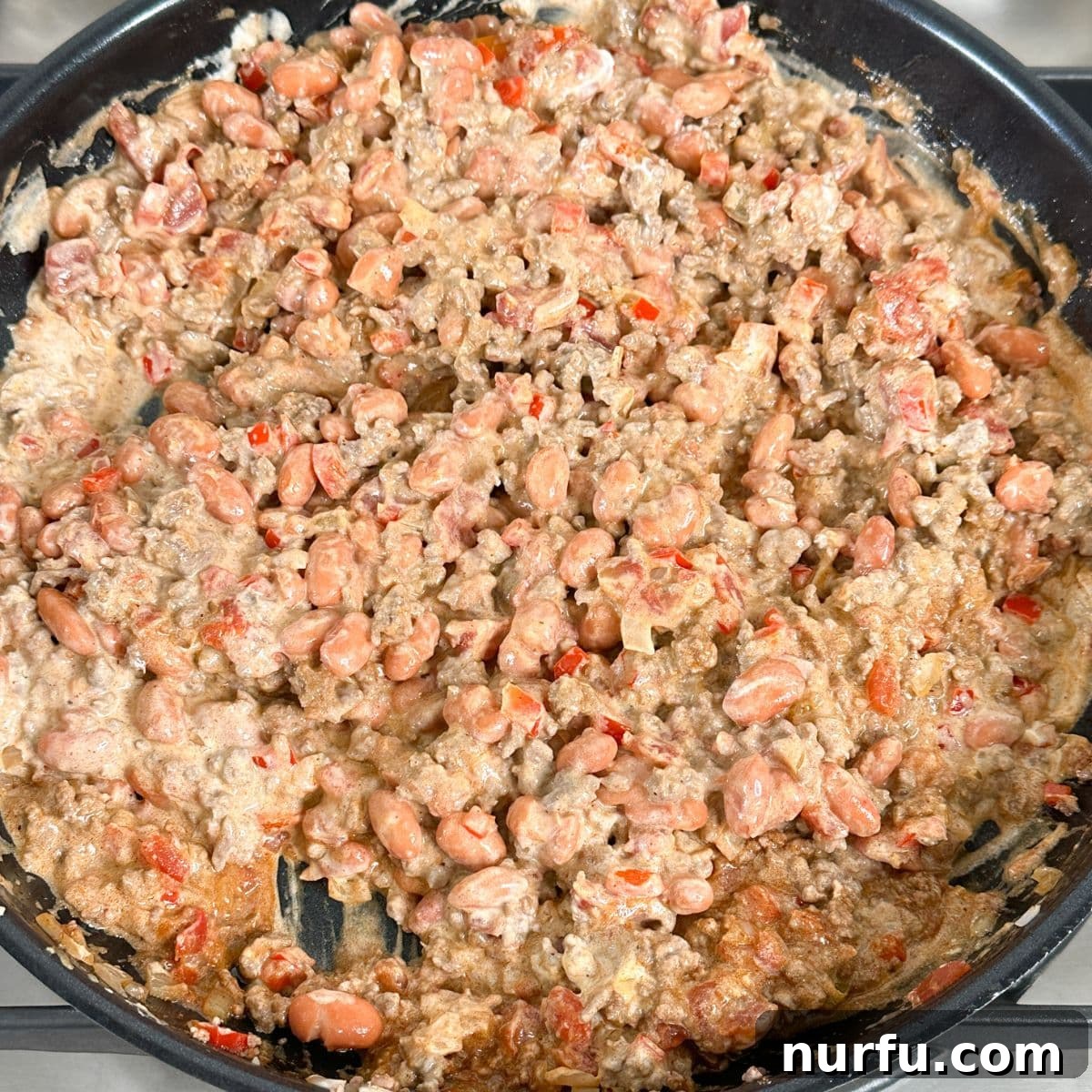 Skillet with perfectly seasoned ground beef mixture.