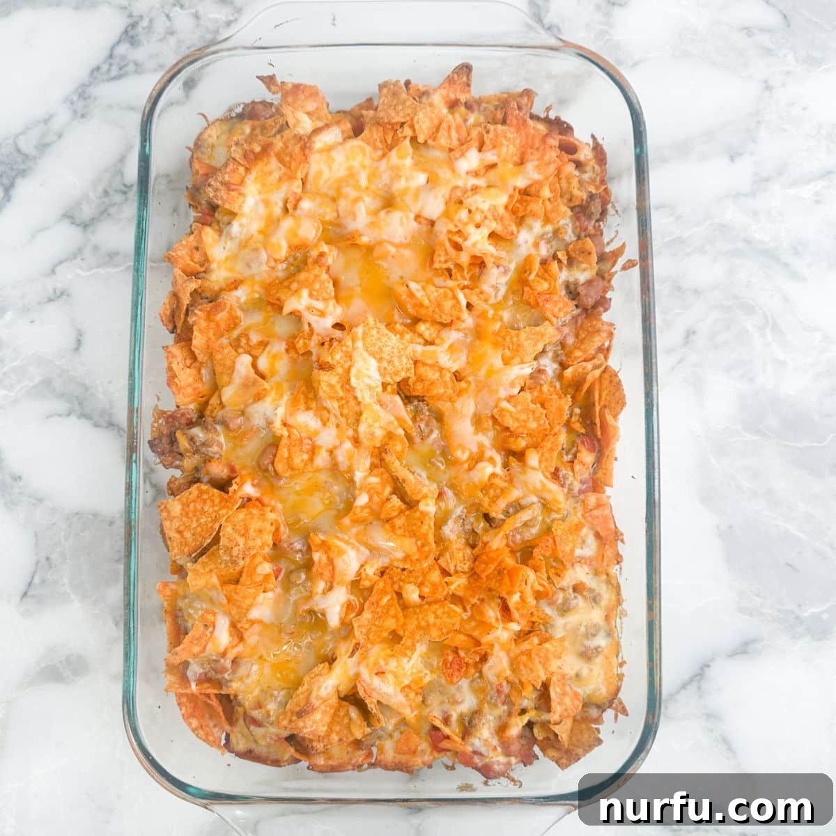 Beautifully baked Doritos casserole, golden and bubbly.