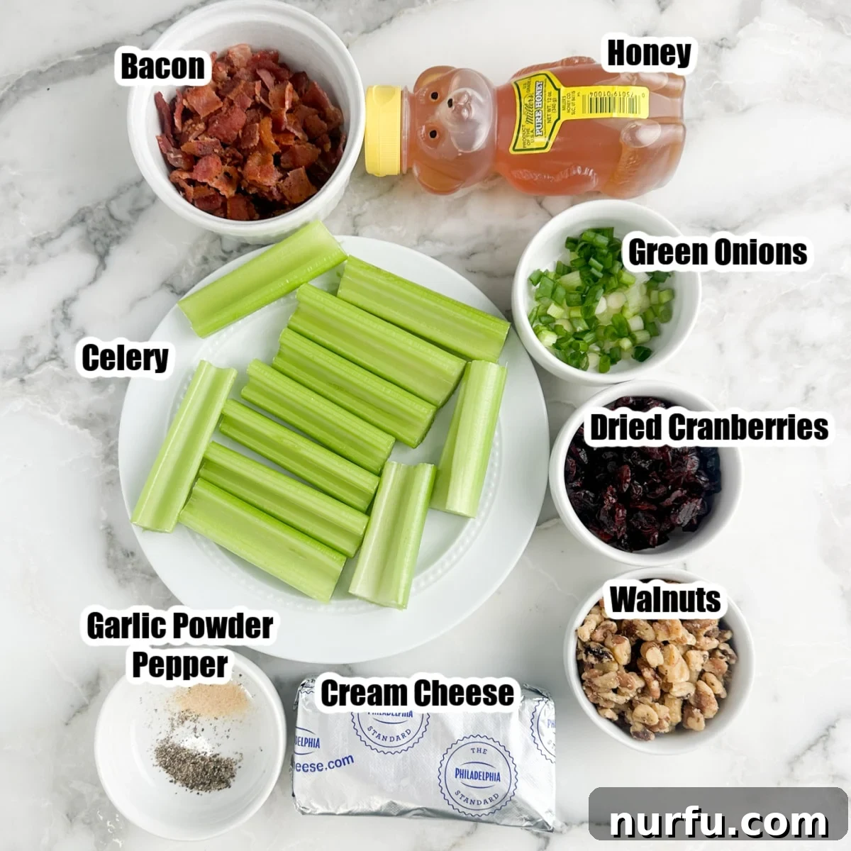 Creamy Celery Crunch 3 Arrangement of fresh celery stalks, bowls containing crispy bacon, chopped walnuts, vibrant green onions, a drizzle of honey, and a block of cream cheese – all key ingredients for the stuffed celery.