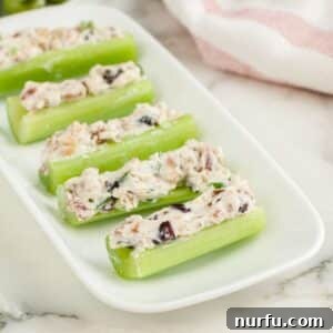 A vibrant plate of stuffed celery, garnished and ready to serve.