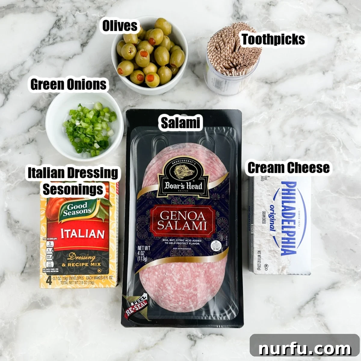Savory Salami Bites 3 Assorted ingredients for salami roll ups: package of salami, Italian dressing seasoning, cream cheese block, green onions, olives, and toothpicks.