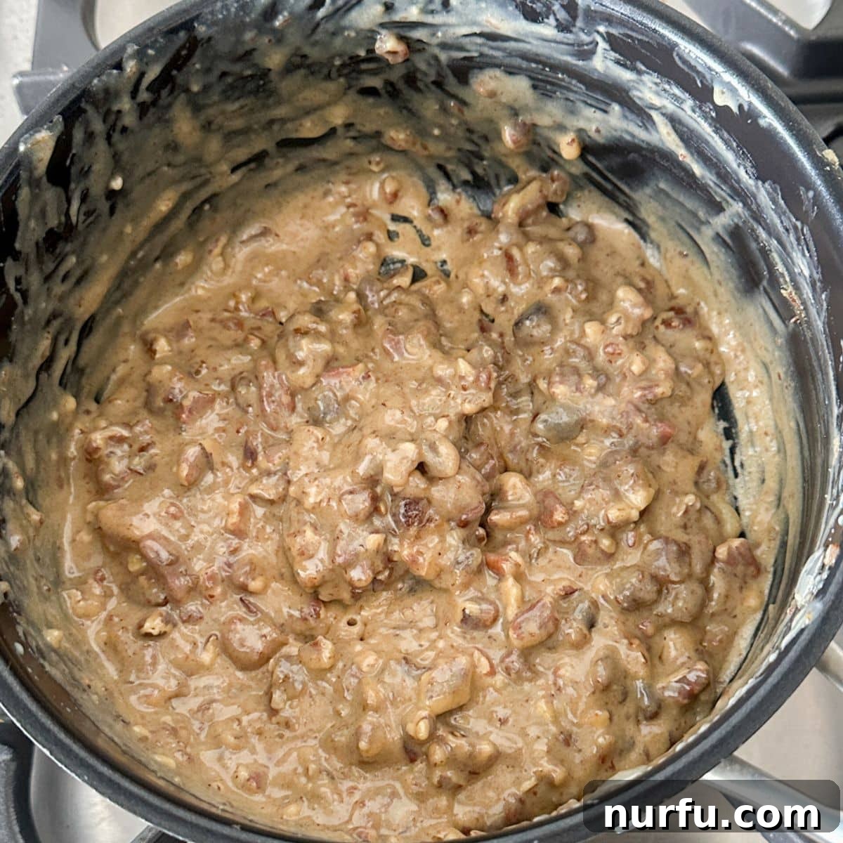Sweet and Salty Ritz Cracker Delights 5 Saucepan with the pecan and date mixture, now thickened and ready to be spread onto crackers.