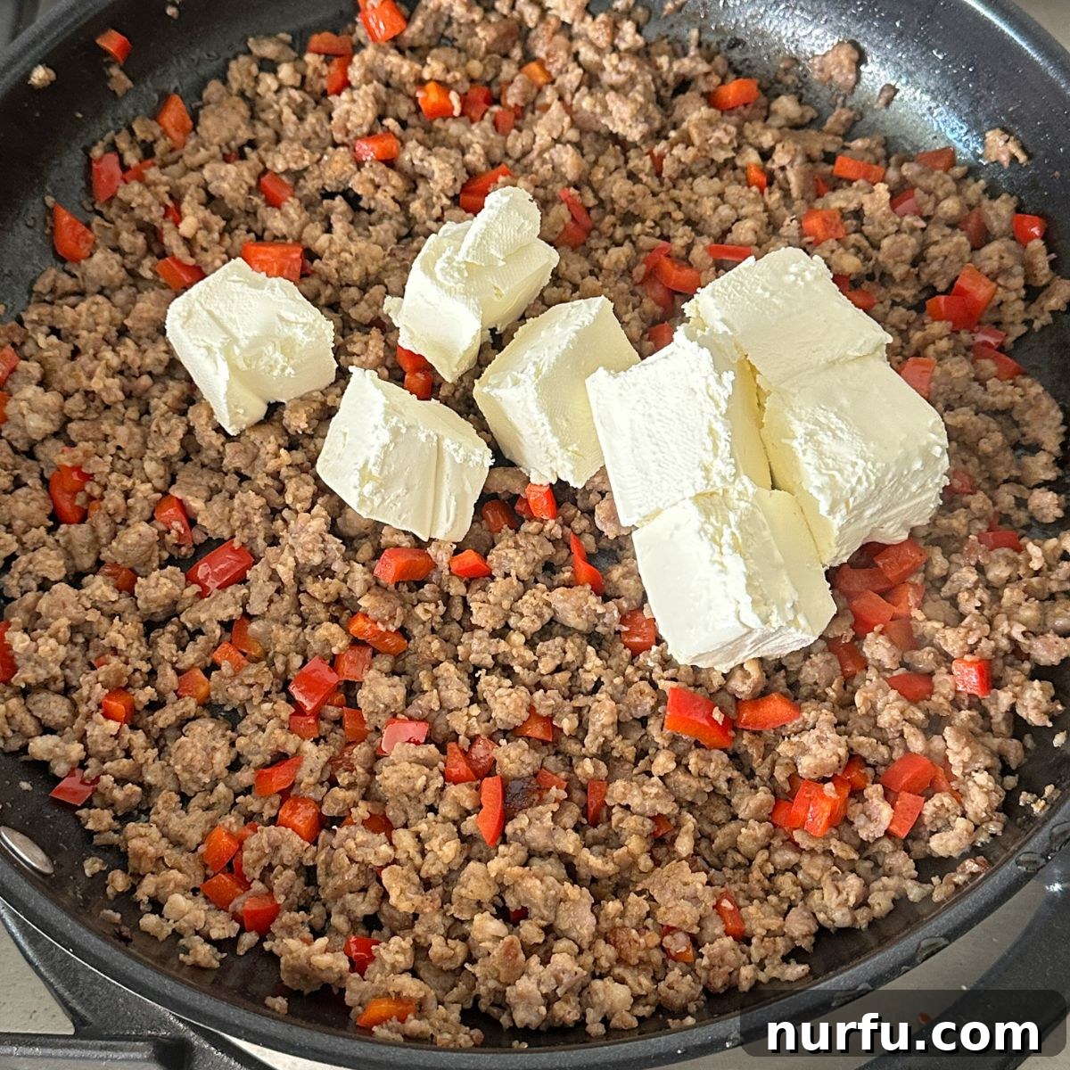 Sausage Cream Cheese Poppers 5 Ground sausage, red bell pepper, and cream cheese.