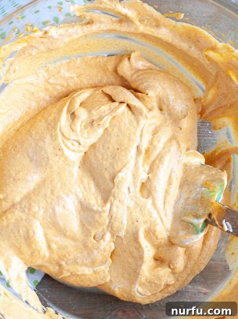 Pumpkin Cream for Trifle A bowl of creamy pumpkin filling, ready for layering.