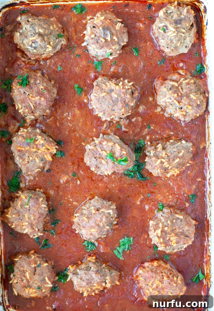 Baked Porcupine Meatballs Freshly baked porcupine meatballs in a casserole dish, removed from the oven and ready to be served.