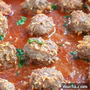 Delicious Porcupine Meatballs in a rich tomato sauce, served in a bowl.