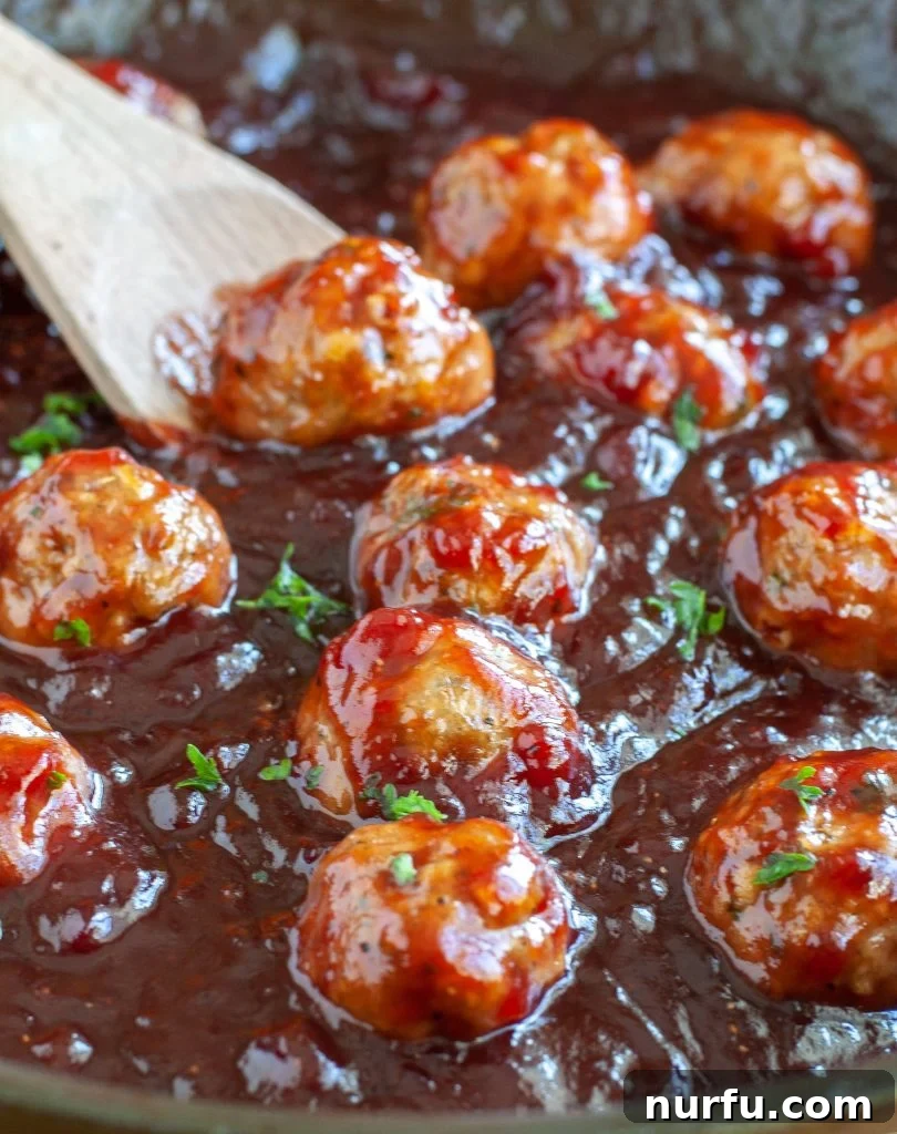 Delicious Baked Turkey Meatballs smothered in homemade Cranberry BBQ Sauce Baked Turkey Meatballs in Cranberry BBQ Sauce