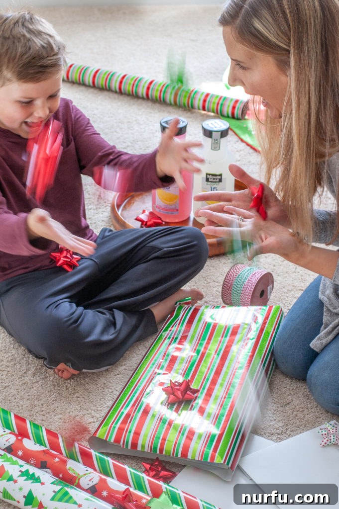 Crafting Unforgettable Holiday Moments with Kids 3 A woman and little boy with a beautifully wrapped present, ready for the holidays.