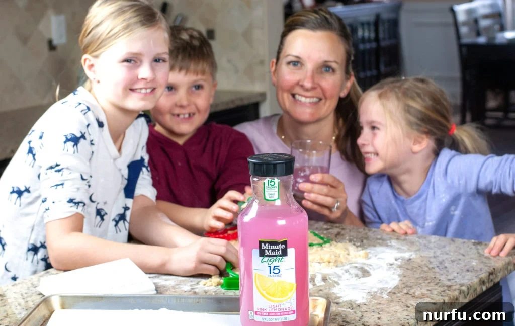 Crafting Unforgettable Holiday Moments with Kids 4 A family enjoying Minute Maid Light Lemonade after a fun cookie baking session.