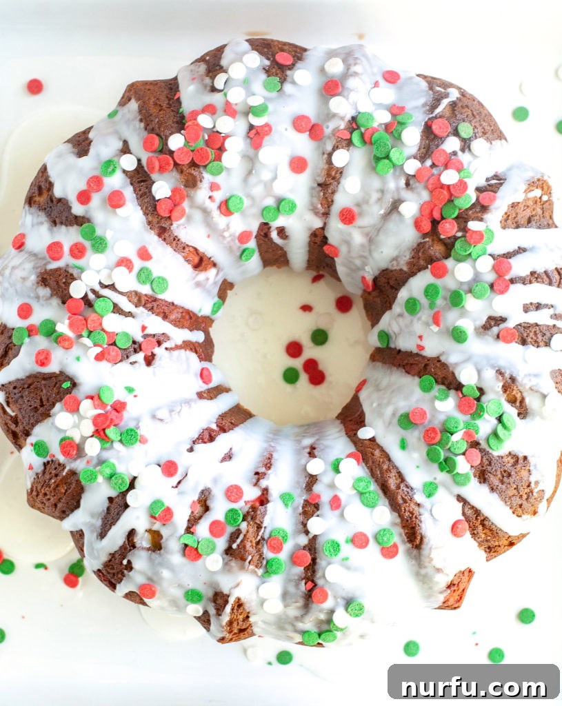 Holiday Bundt Cake Another view of the Holiday Bundt Cake, showcasing its beautiful shape and festive topping on a plate