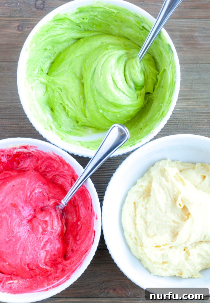Red, Green and White Batter Three bowls of cake batter: one red, one green, and one white, ready for layering