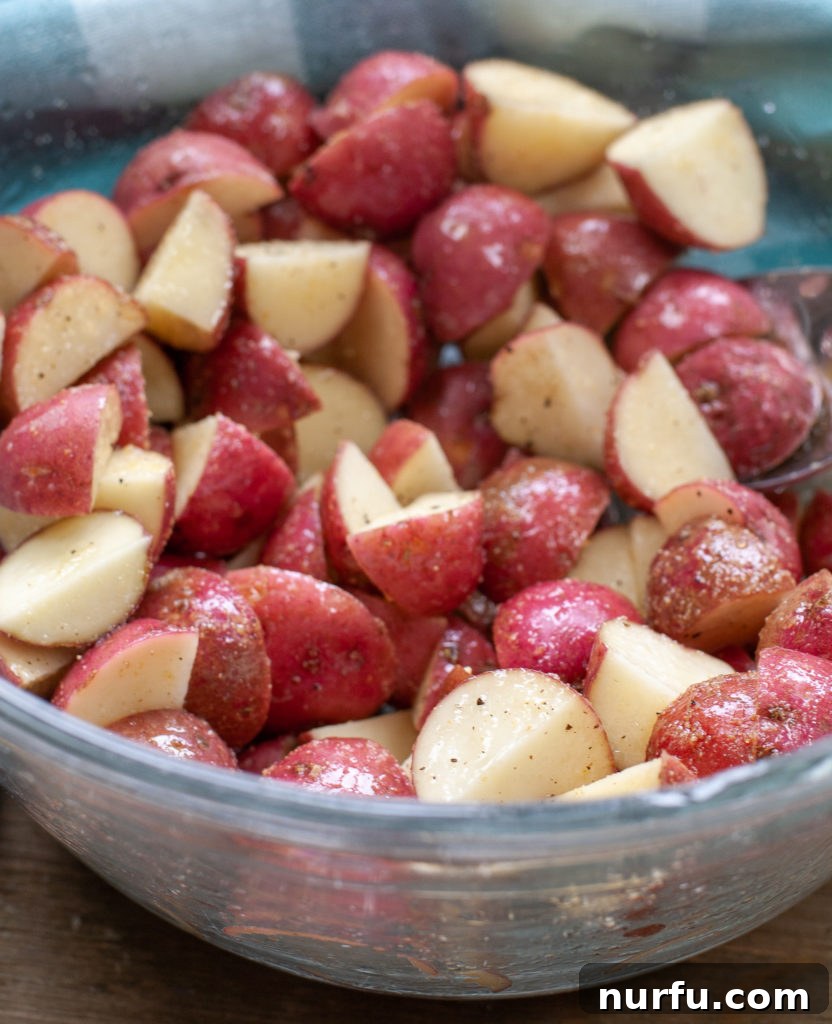 Bowl of Seasoned Red Potatoes Bowl of seasoned red potatoes, ready for air frying.