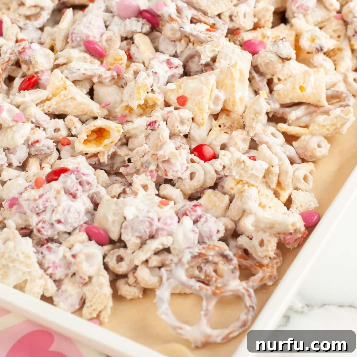 Baking pan with Valentines cupid snack mix.
