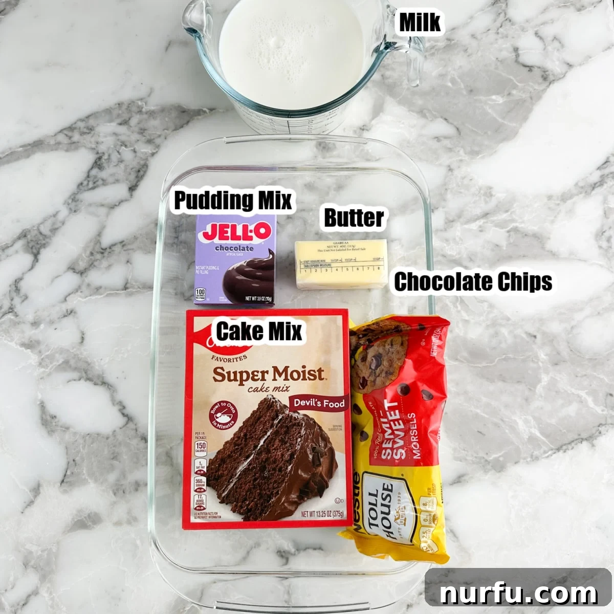 Effortless Chocolate Delight 3 Display of key ingredients: box of chocolate cake mix, instant pudding mix, butter, chocolate chips, and milk.