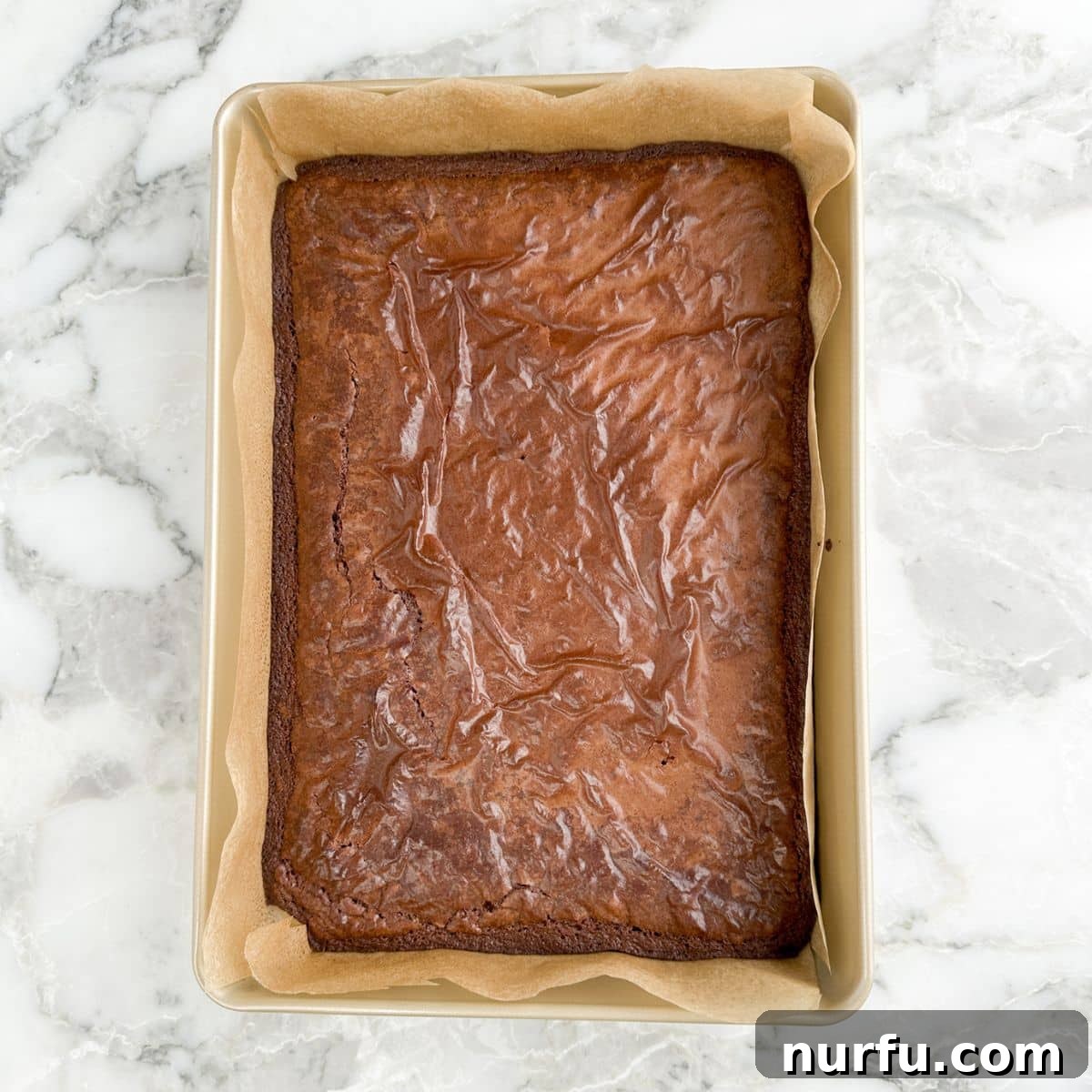 Irresistible Chocolate Cherry Brownie Bites 4 A pan of freshly baked, cooled brownies, ready for crumbling.