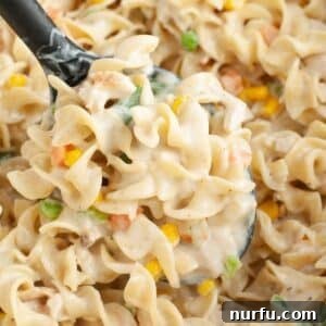 Hearty Chicken Pot Pie Pasta 11 Spoon with chicken pot pie pasta.