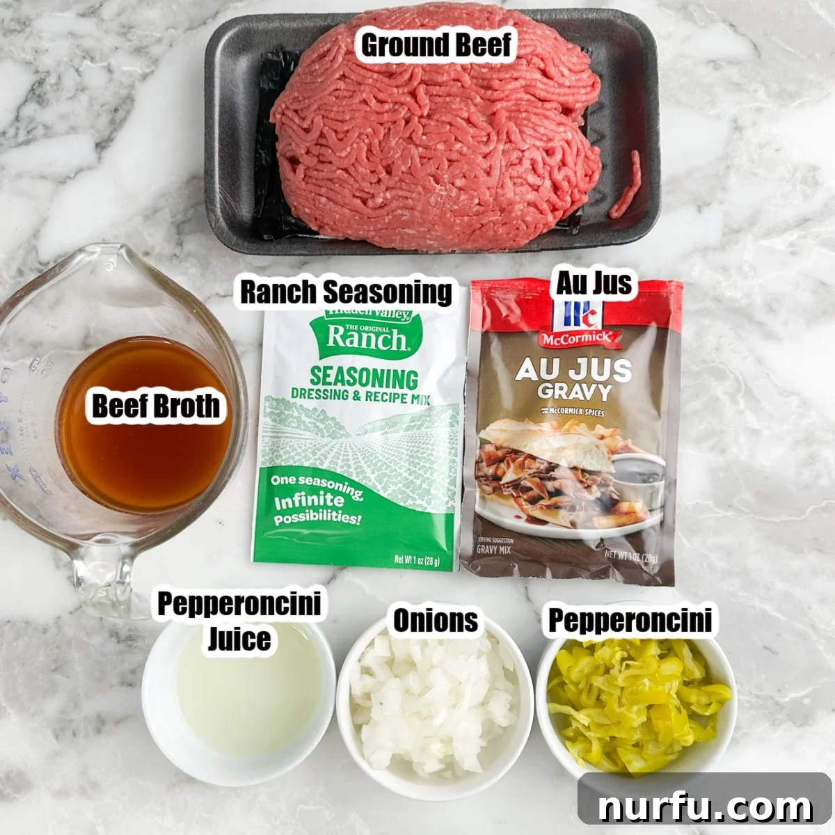 Mississippi Roadhouse Sloppy Joes 3 Layout of ingredients for Mississippi sloppy joes: ground beef, beef broth, ranch seasoning packet, au jus packet, diced onion, and jarred pepperoncinis.