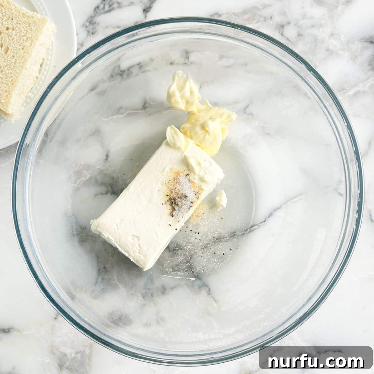 Elegant Cucumber Tea Bites 4 Bowl of cream cheese, mayonnaise, and seasonings being mixed.