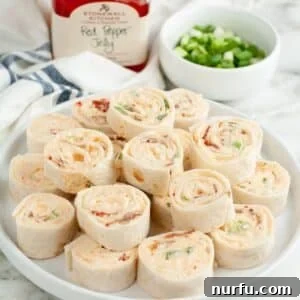 Plate of pepper jelly pinwheels.