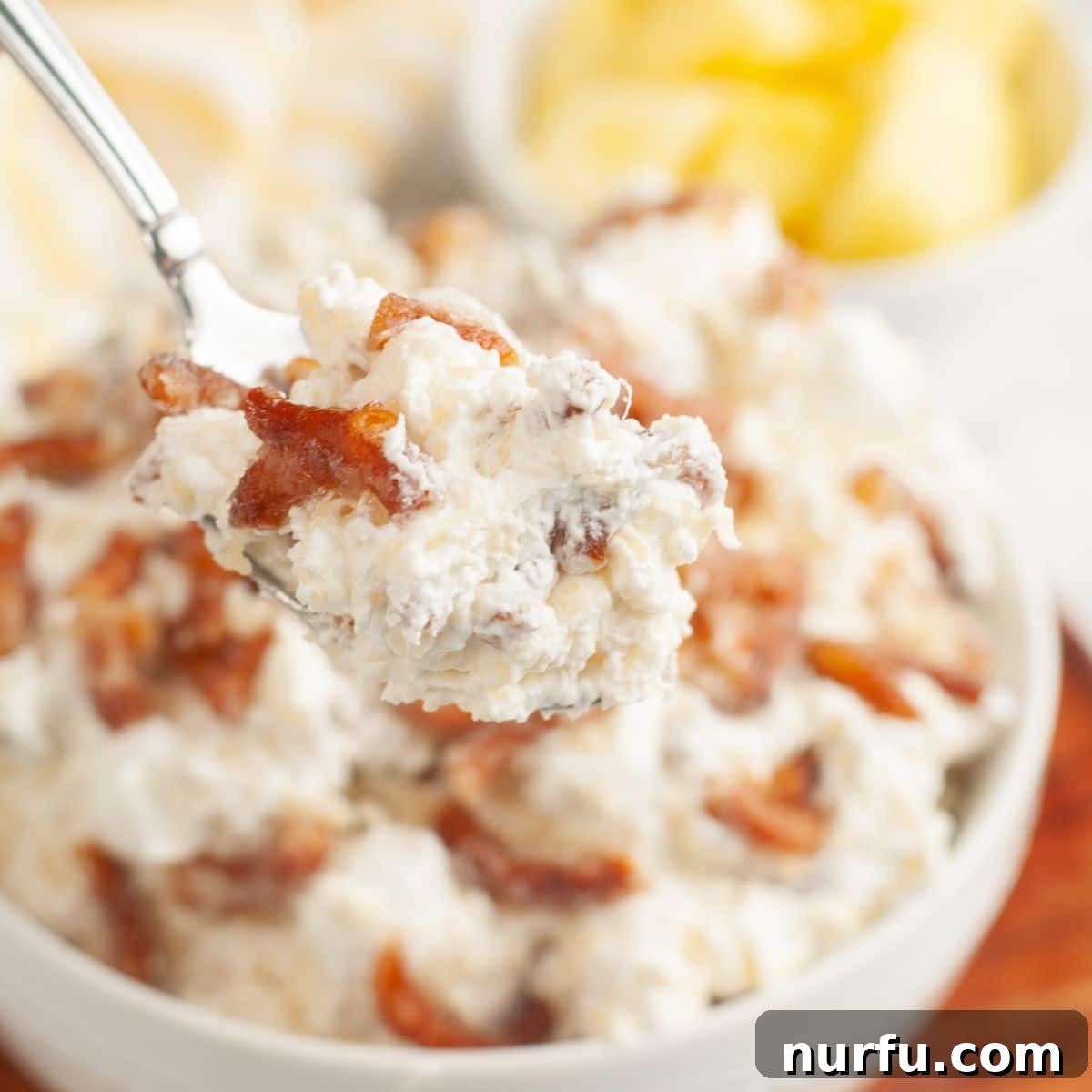 Sweet and Salty Pineapple Swirl 11 Bowl of pineapple pretzel fluff, ready to be served, highlighting its irresistible layers.