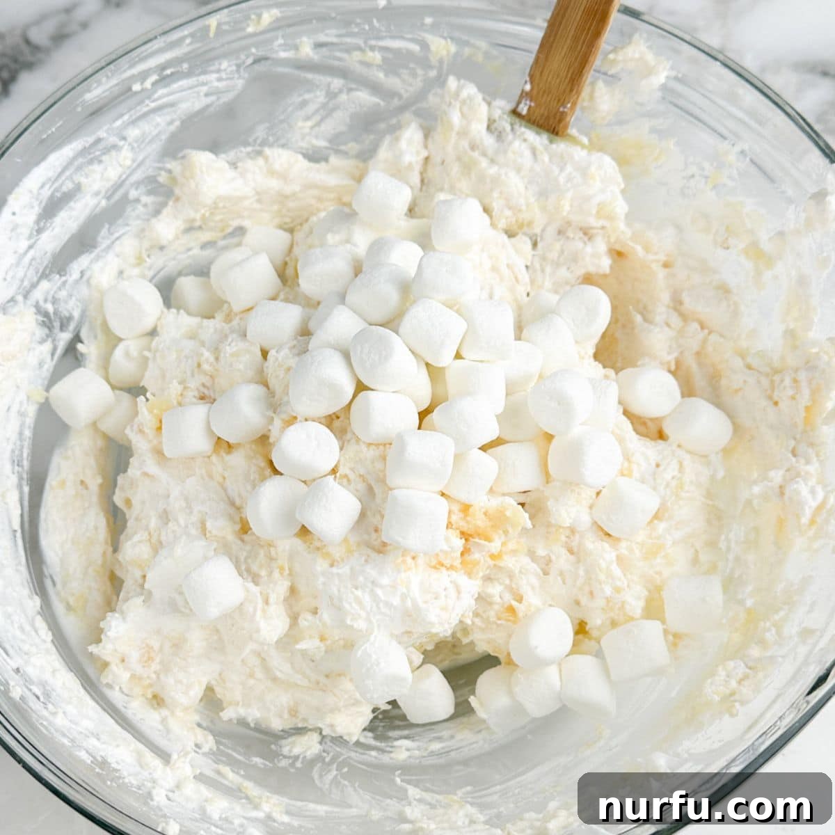 Sweet and Salty Pineapple Swirl 8 Bowl of pineapple fluff mixture, creamy and light.