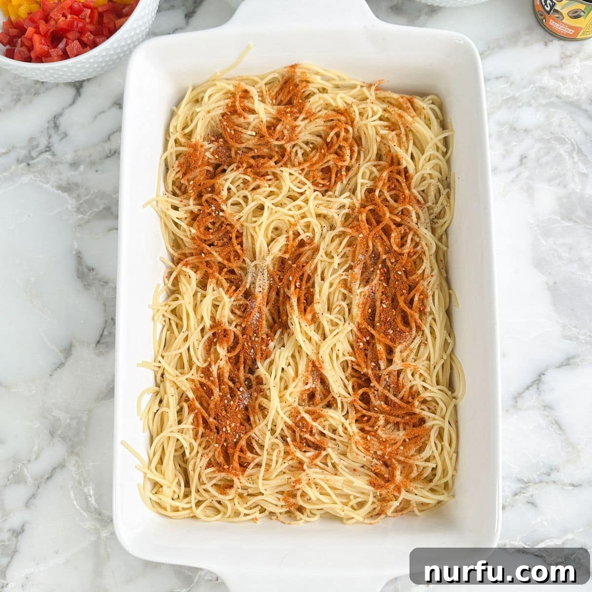 Zesty Spaghetti Salad 6 Casserole dish with spaghetti noodles and Salad Supreme seasoning.