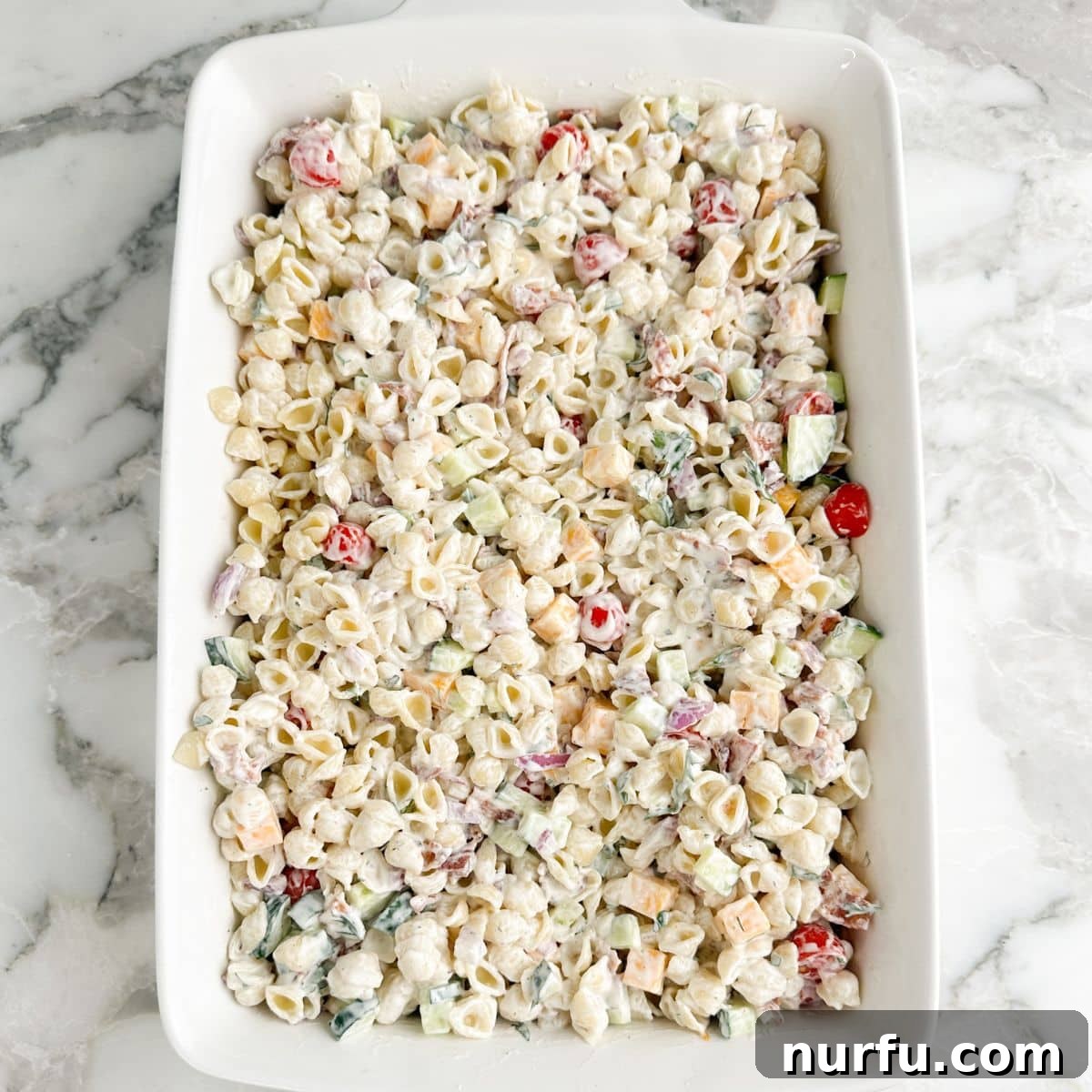 Creamy Ranch Pasta Salad Recipe with Bacon and Veggies 7 Ranch pasta salad in a casserole dish.