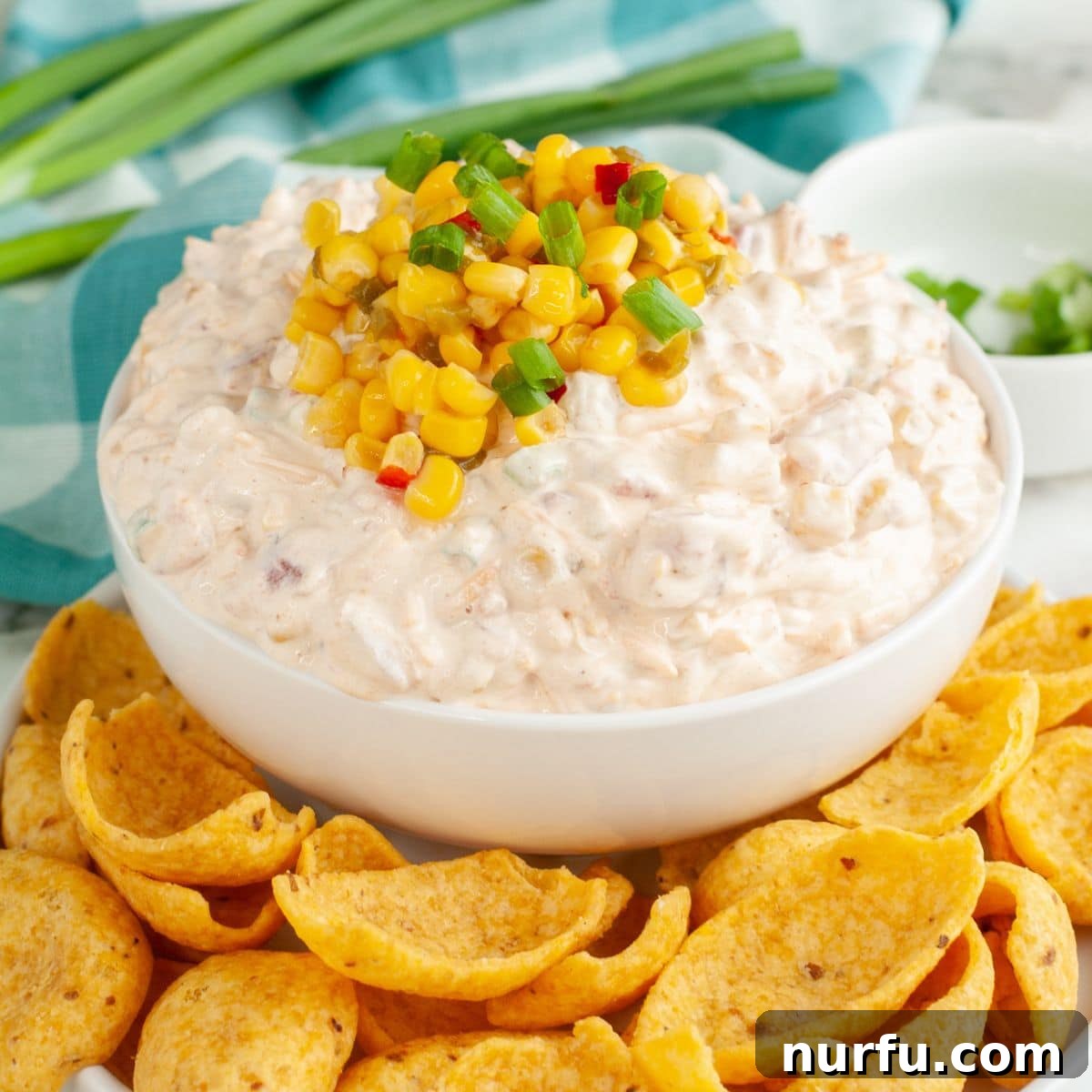 Creamy Fiesta Corn Dip Recipe for Parties and Game Day 6 Bowl of fiesta corn dip topped with corn kernels.