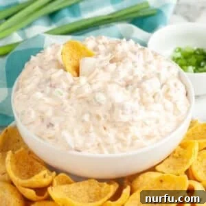 Creamy Fiesta Corn Dip Recipe for Parties and Game Day 7 Bowl of fiesta corn dip with corn chips.