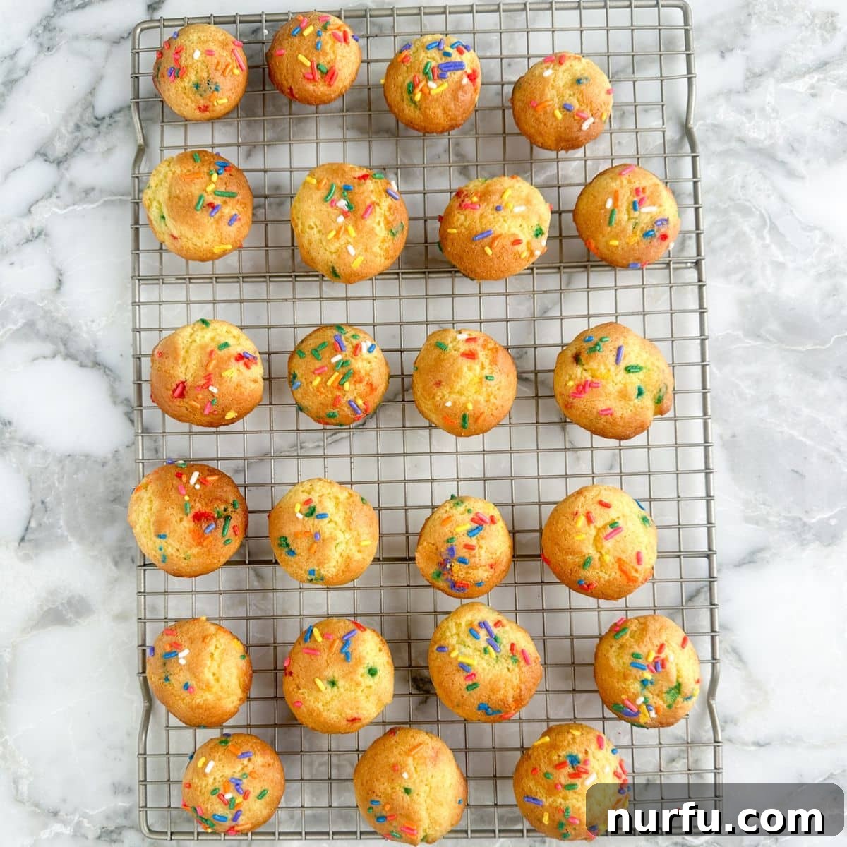 How to Make Sprinkle Blossoms: Cute Cake & Cookie Toppers 5 Cooling rack with mini Funfetti cakes.