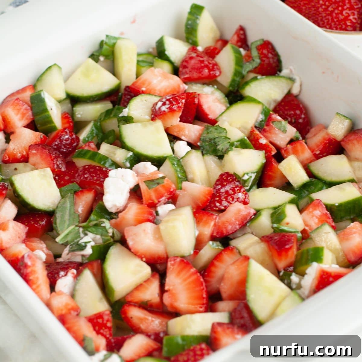 Strawberry Cucumber Salad with Mint and Balsamic Dressing 9 Dish with strawberry cucumber basil salad.
