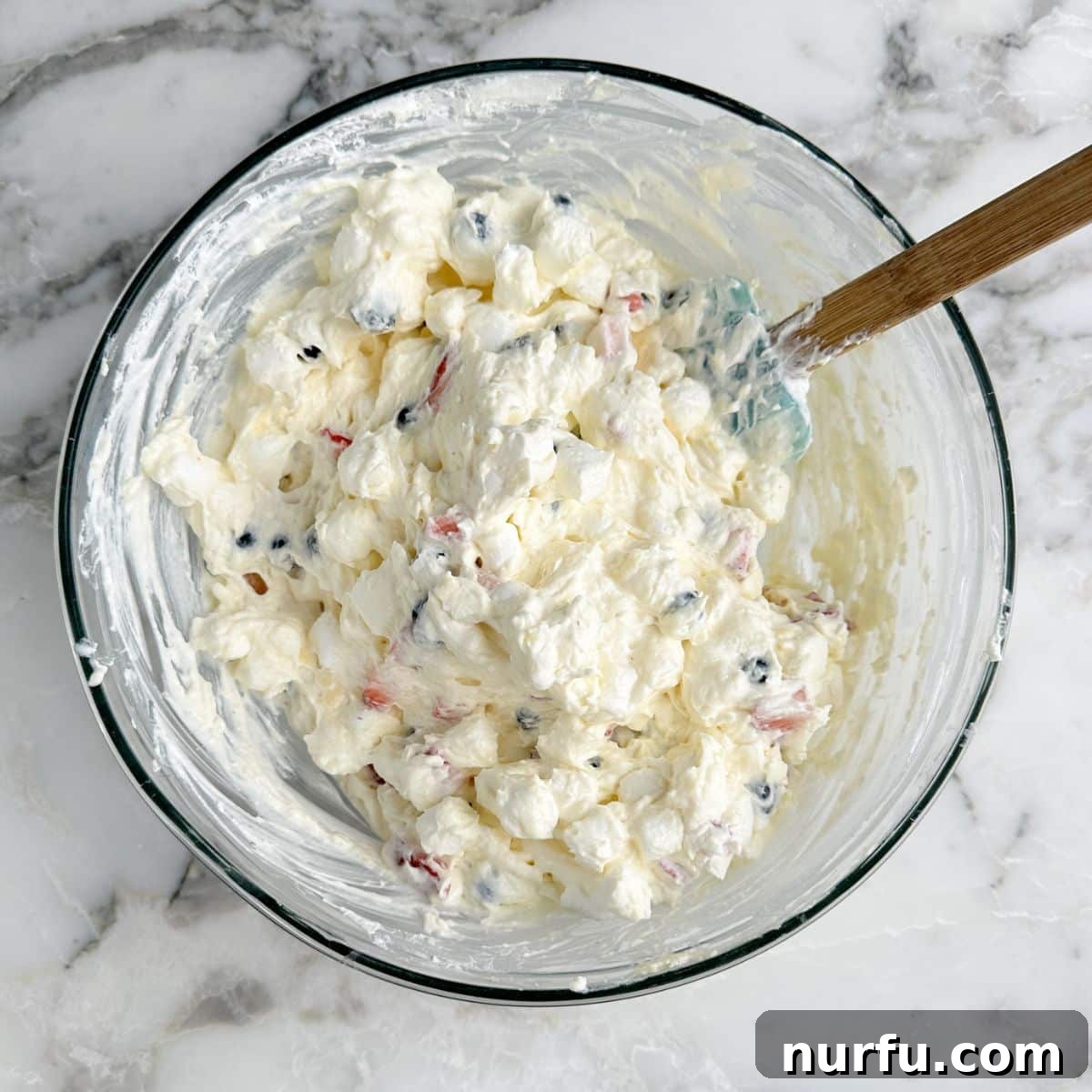 Patriotic Red, White & Blue Cheesecake Salad Recipe 6 Bowl with red white and blue cheesecake dessert.