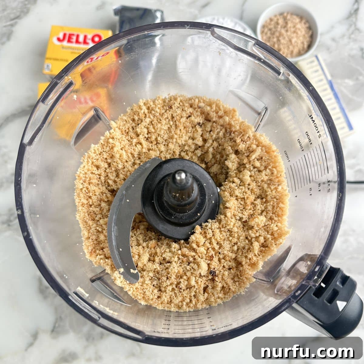 Butterscotch Dessert Recipes for Irresistible Treats 4 Food processor with crush pecan sandies cookies.