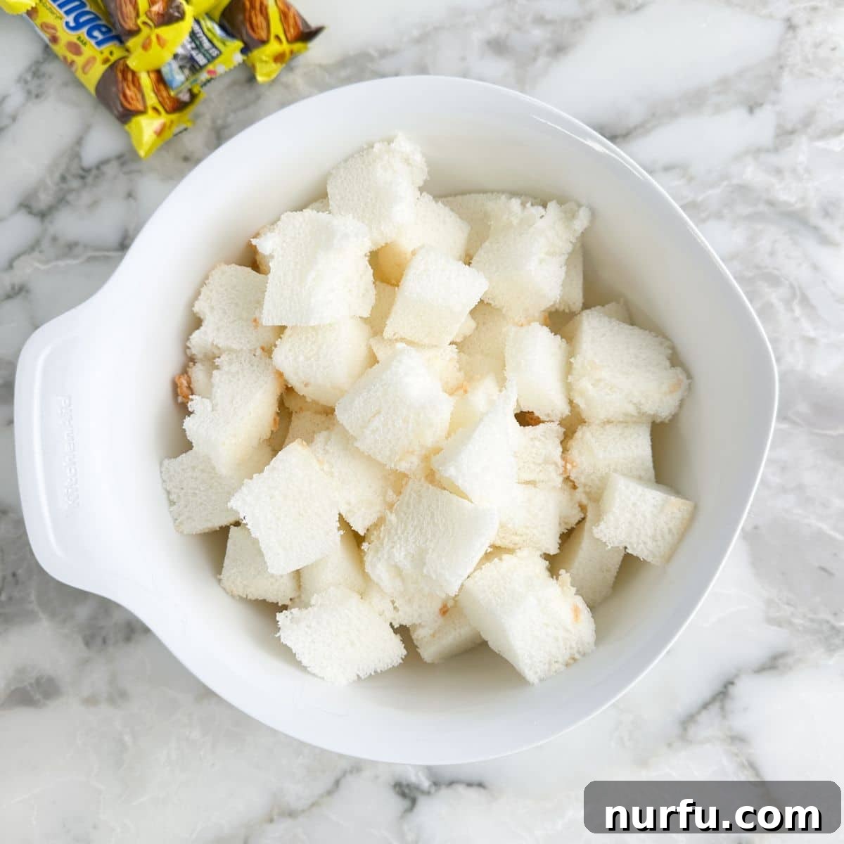 Irresistible Butterfinger Dessert Recipes for Chocolate Lovers 4 Bowl of cubed angel food cake.