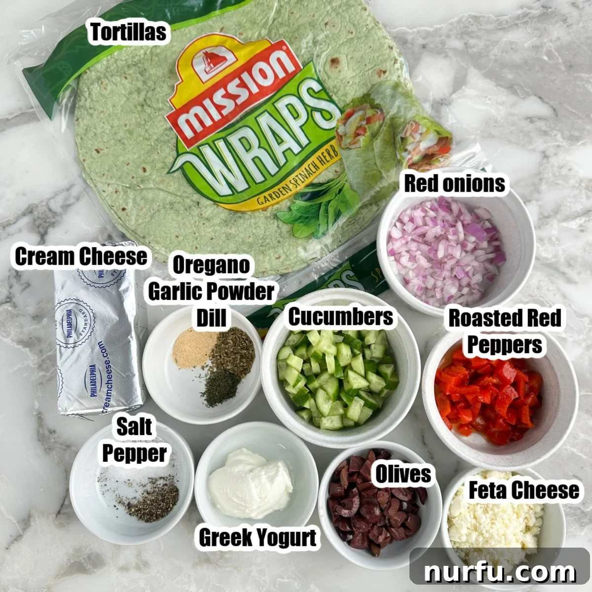 Greek Pinwheel Appetizers: Spinach, Feta & Olive Rolls 3 Spinach tortillas, bowls of red onions, cucumber, Greek yogurt, roasted red pepper, Feta cheese, olives, cream cheese, and seasonings.