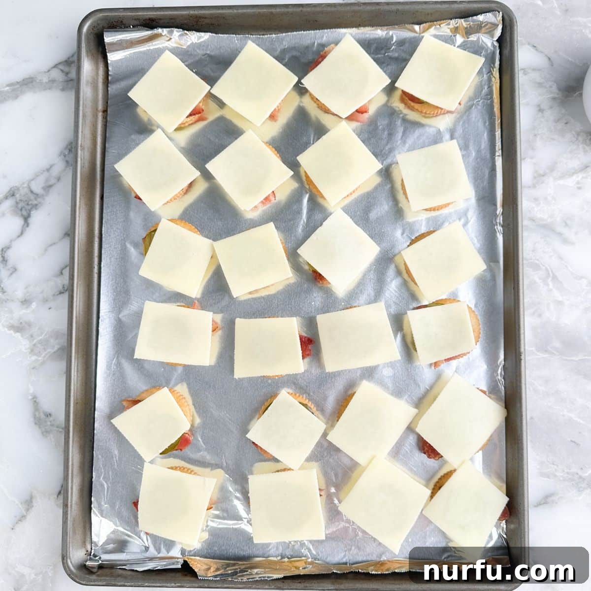 Ritz Crackers with Bacon and Pickle Spread: Crispy Party Snack 6 Crackers topped with bacon, pickles, and cheese.