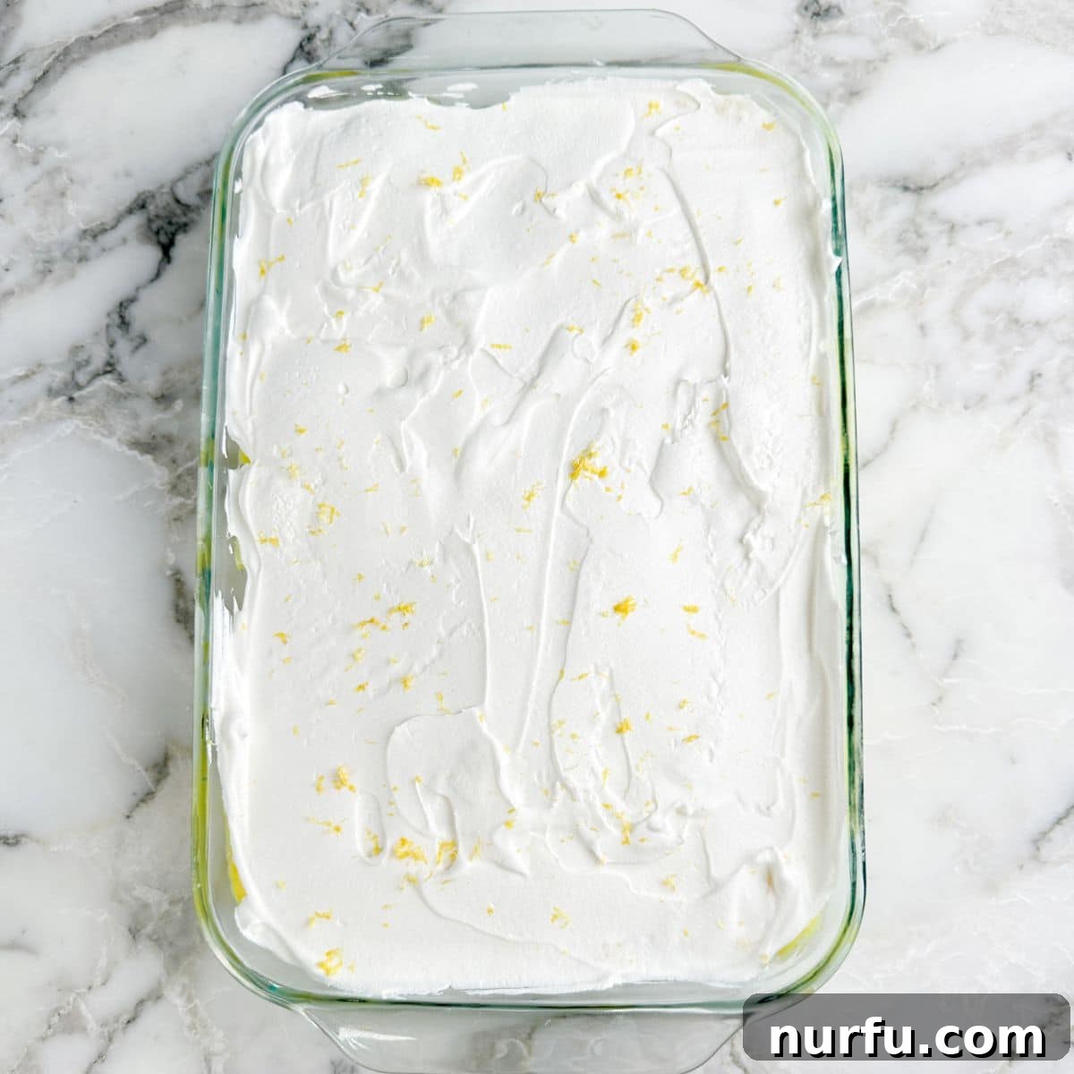 Baking dish with no bake lemon lush dessert.