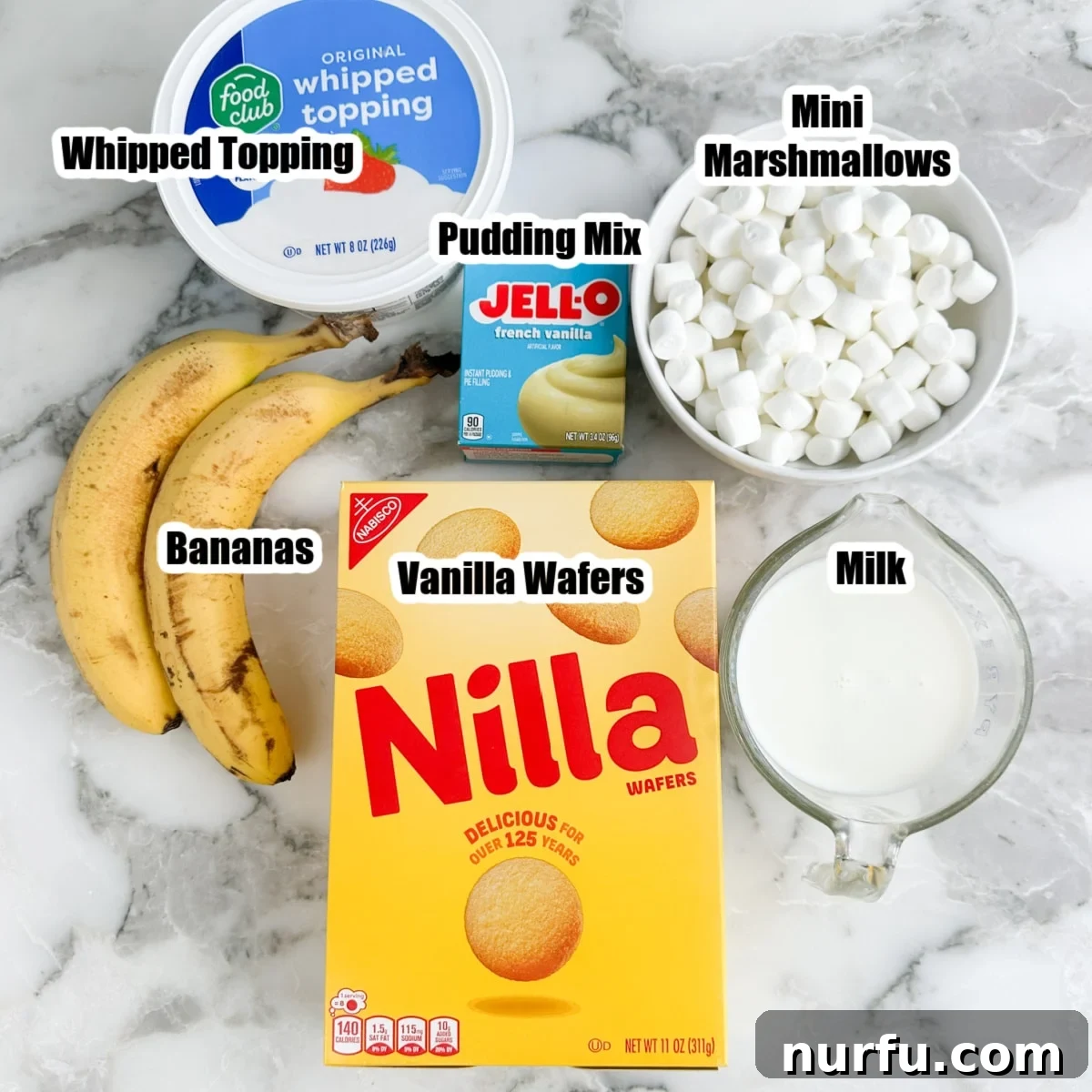 Bananas, whipped topping, pudding mix, vanilla wafers, milk, and mini marshmallows.