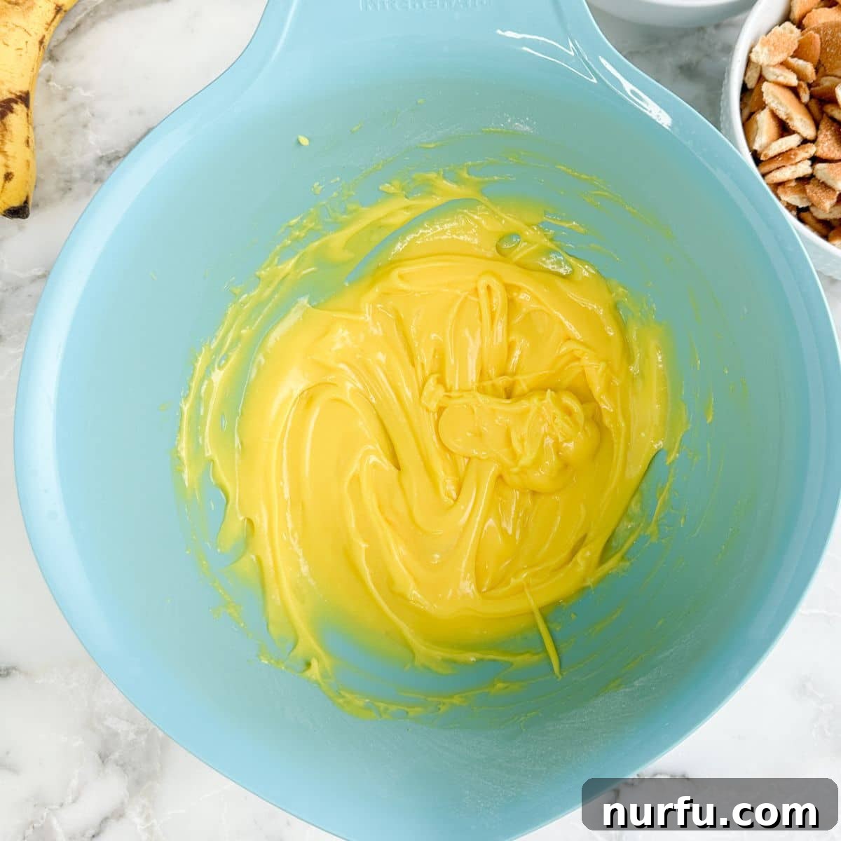 Bowl with vanilla pudding.