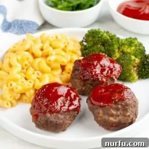 Mini Meatloaf Muffins Recipe with Cheesy Center 7 Plate with meatloaf muffins, mac and cheese, and broccoli.