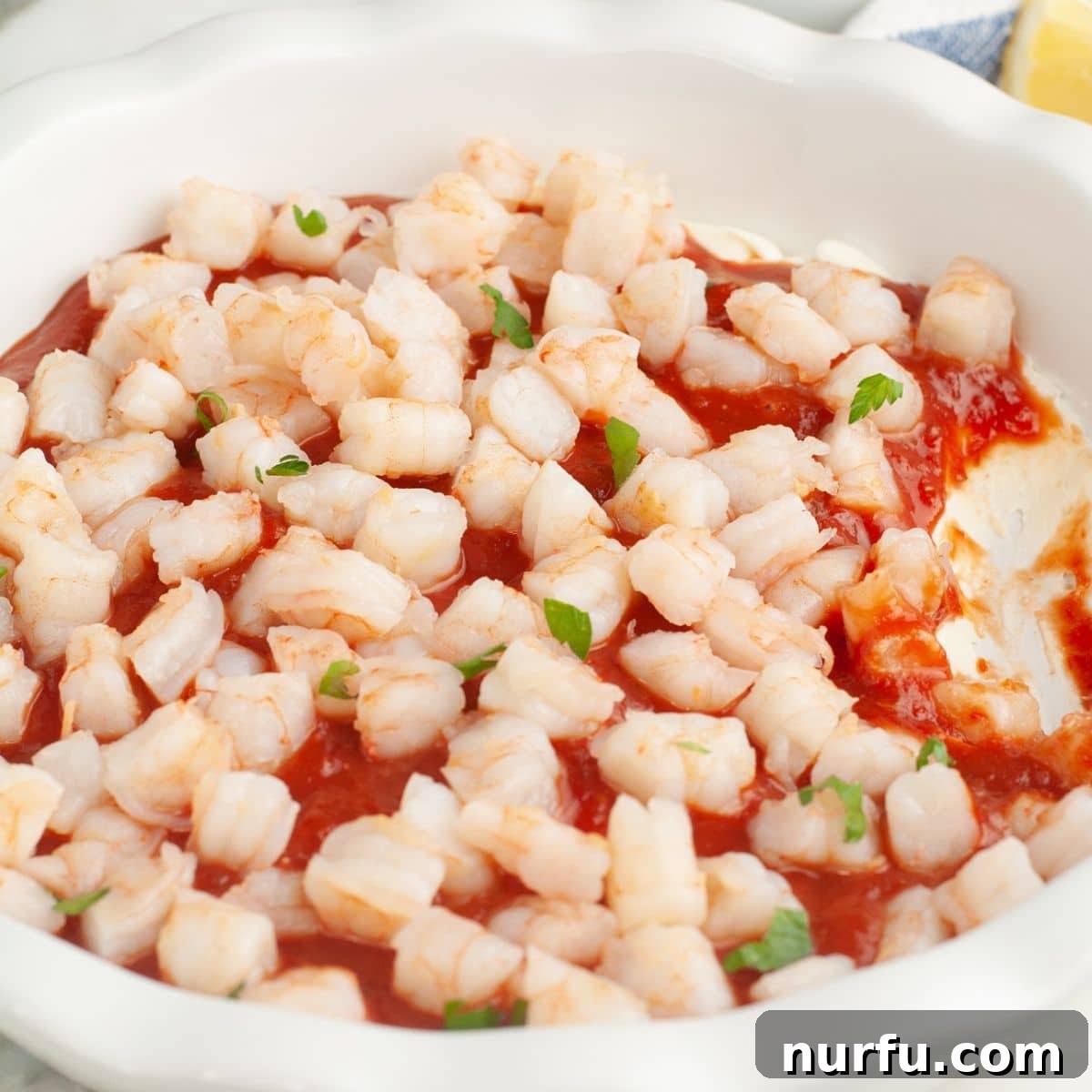 Baking dish with shrimp cream cheese dip.
