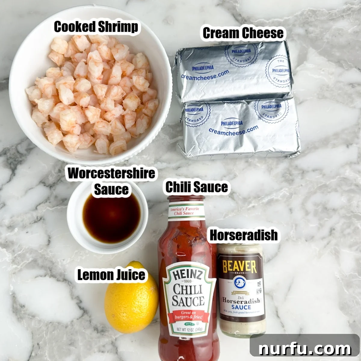 Bowl of cooked shrimp, cream cheese, chili sauce, horseradish, lemon juice, Worcestershire sauce.