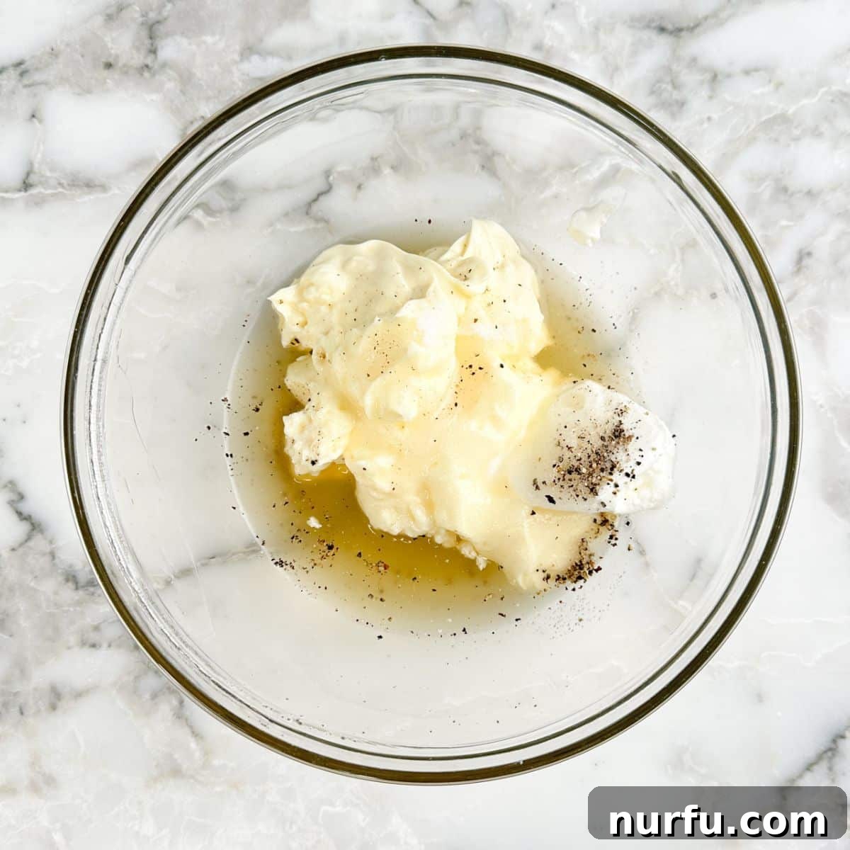 Bowl with mayonnaise, sour cream, vinegar.