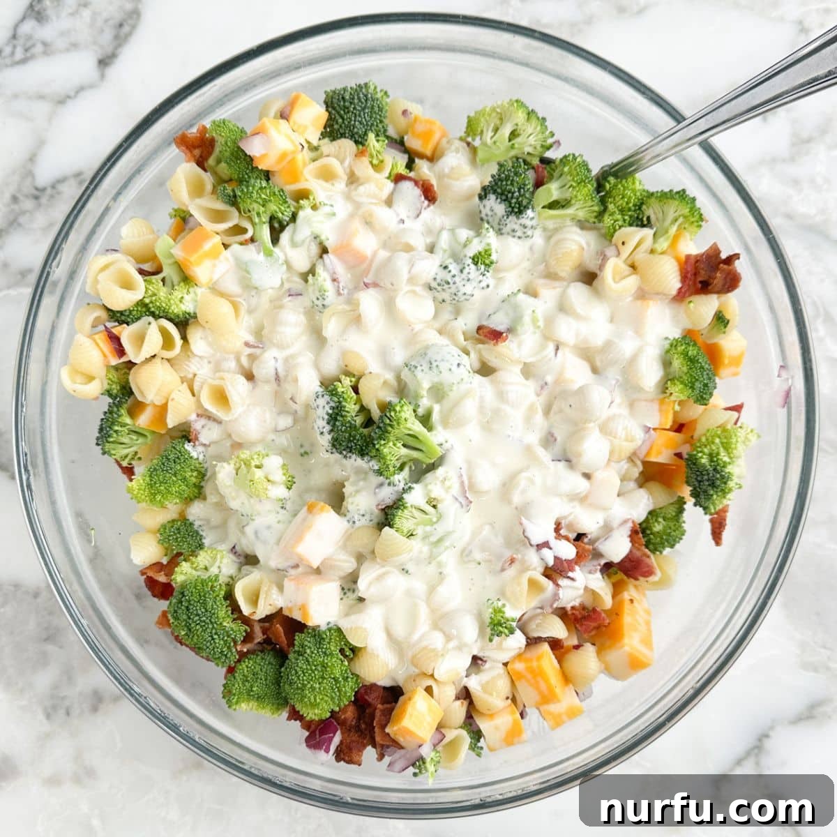 Bowl with broccoli pasta salad.