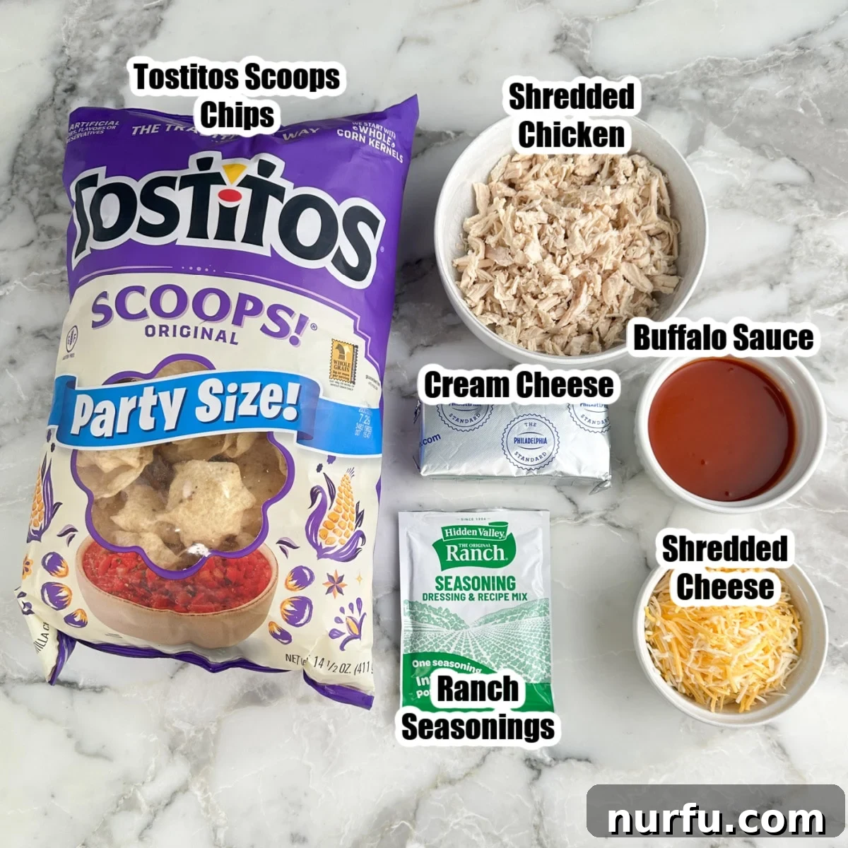 Buffalo Chicken Dip Bites Recipe for Game Day 3 Bag of tortilla chips, shredded chicken, ranch seasonings, cream cheese, buffalo sauce, and shredded cheese.
