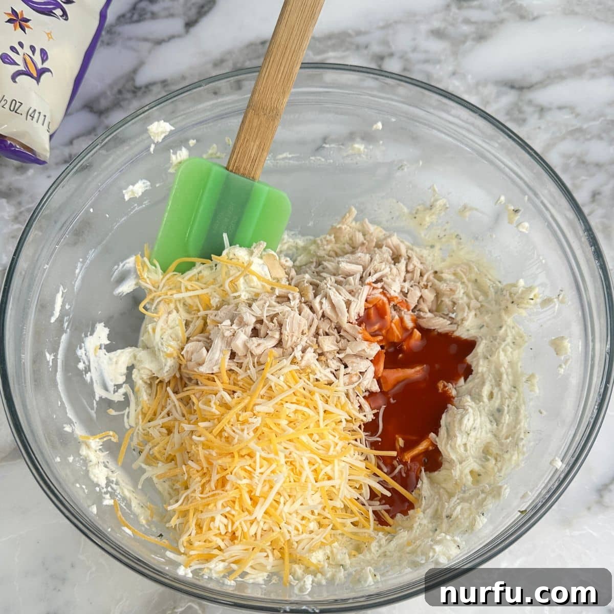 Buffalo Chicken Dip Bites Recipe for Game Day 5 Bowl with cream cheese, shredded cheese, chicken, and buffalo sauce.