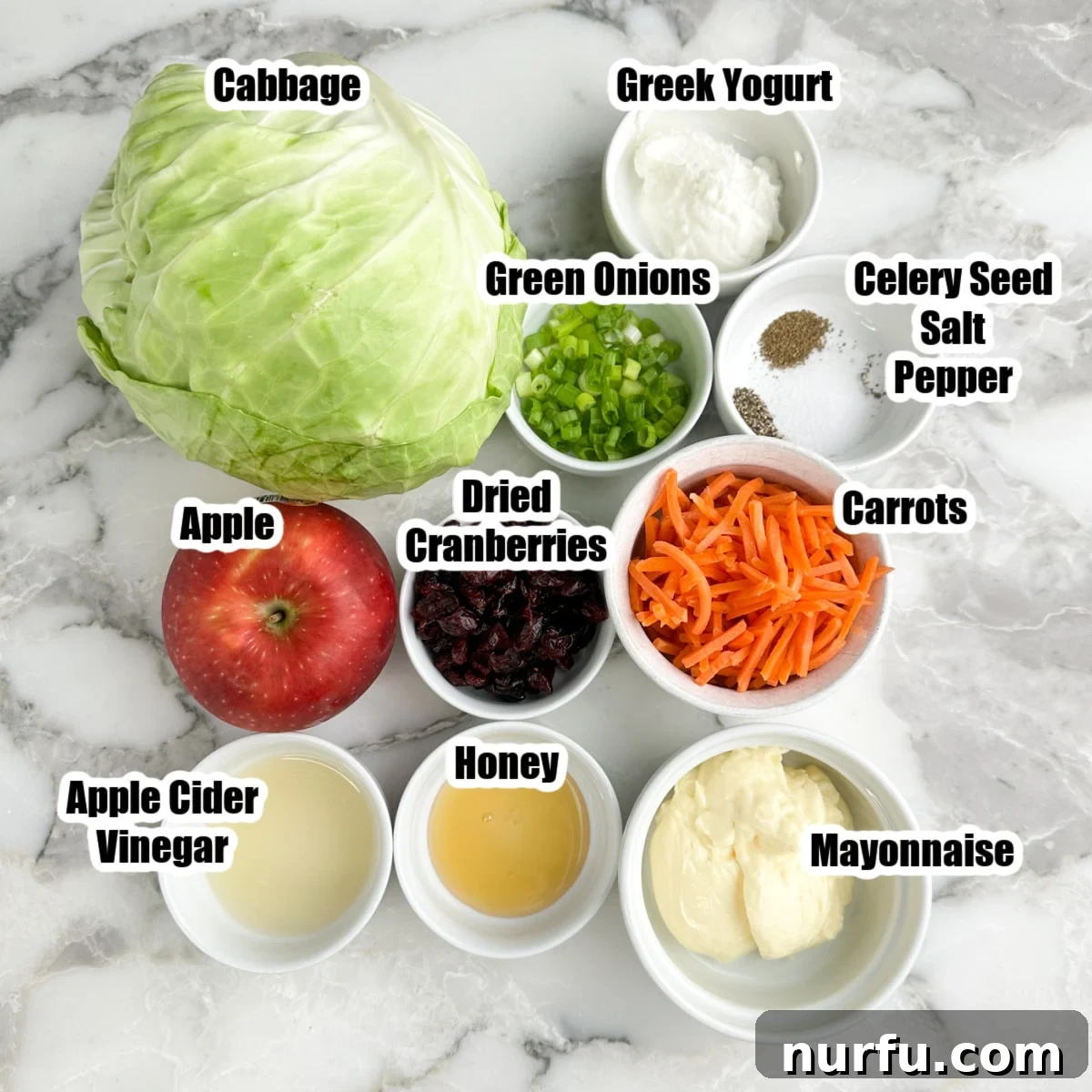 Crisp Apple and Cranberry Slaw with Maple Dijon Dressing 3 Cabbage, carrots, apple, green onions, mayonnaise, greek yogurt, vinegar, cranberries, honey, and seasonings.